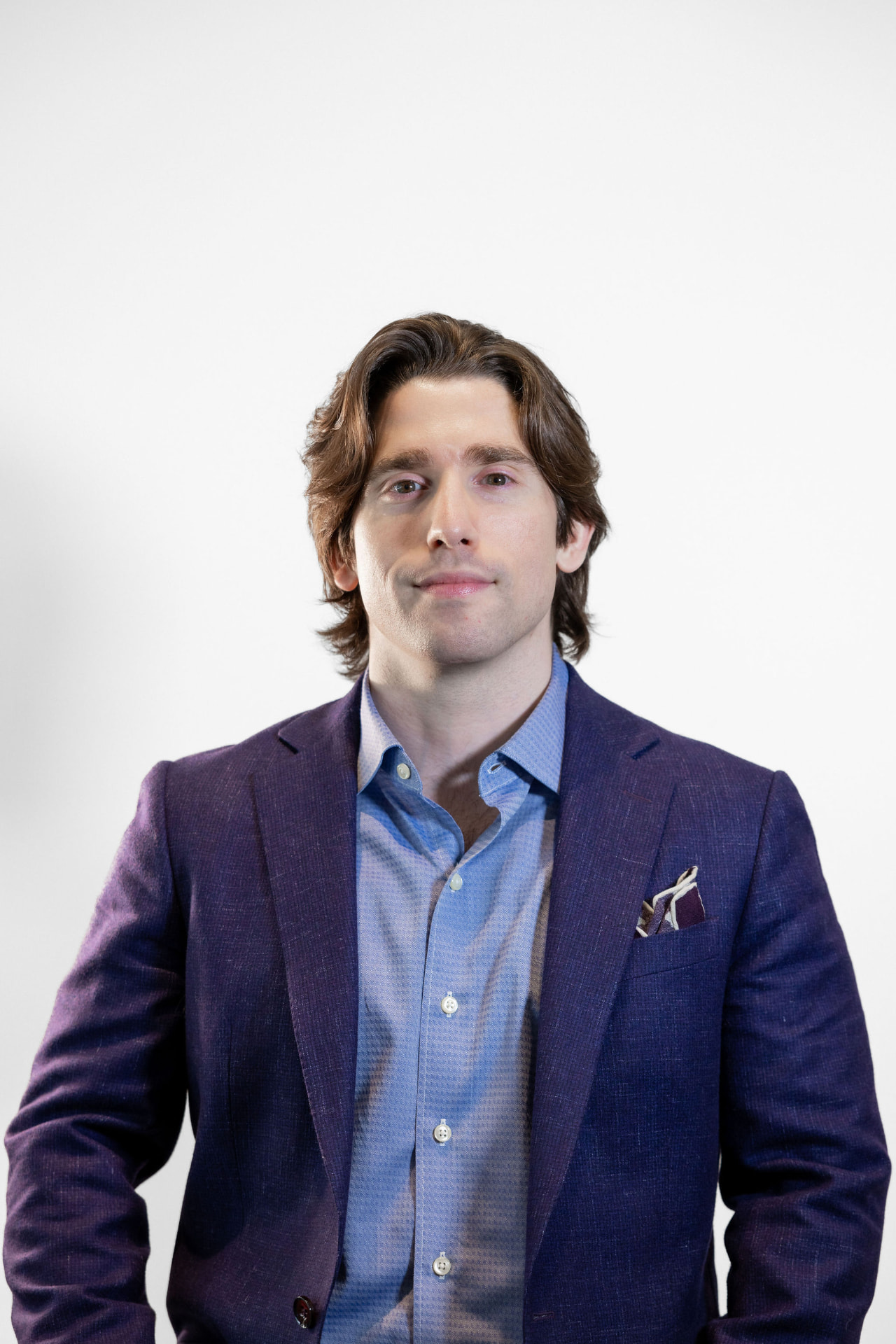 Mark Laird in a purple blazer and blue button-down shirt