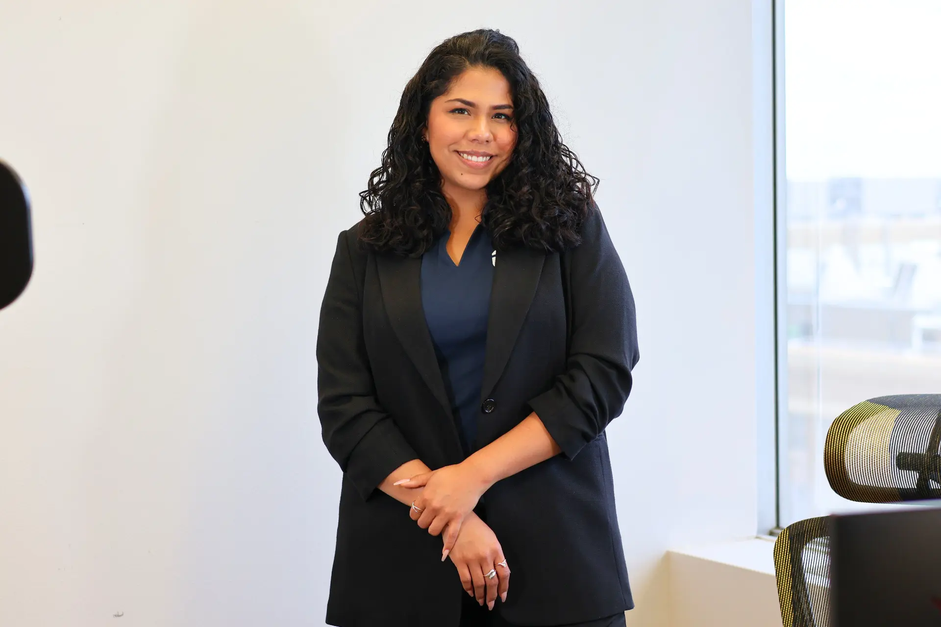 Priscilla Ibarra wearing a black blazer and navy blouse