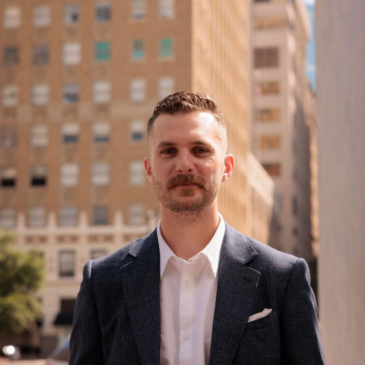 Victor Smargiasso in a tailored blazer on a city street